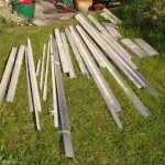 Greenhouse frame pieces laid out on lawn